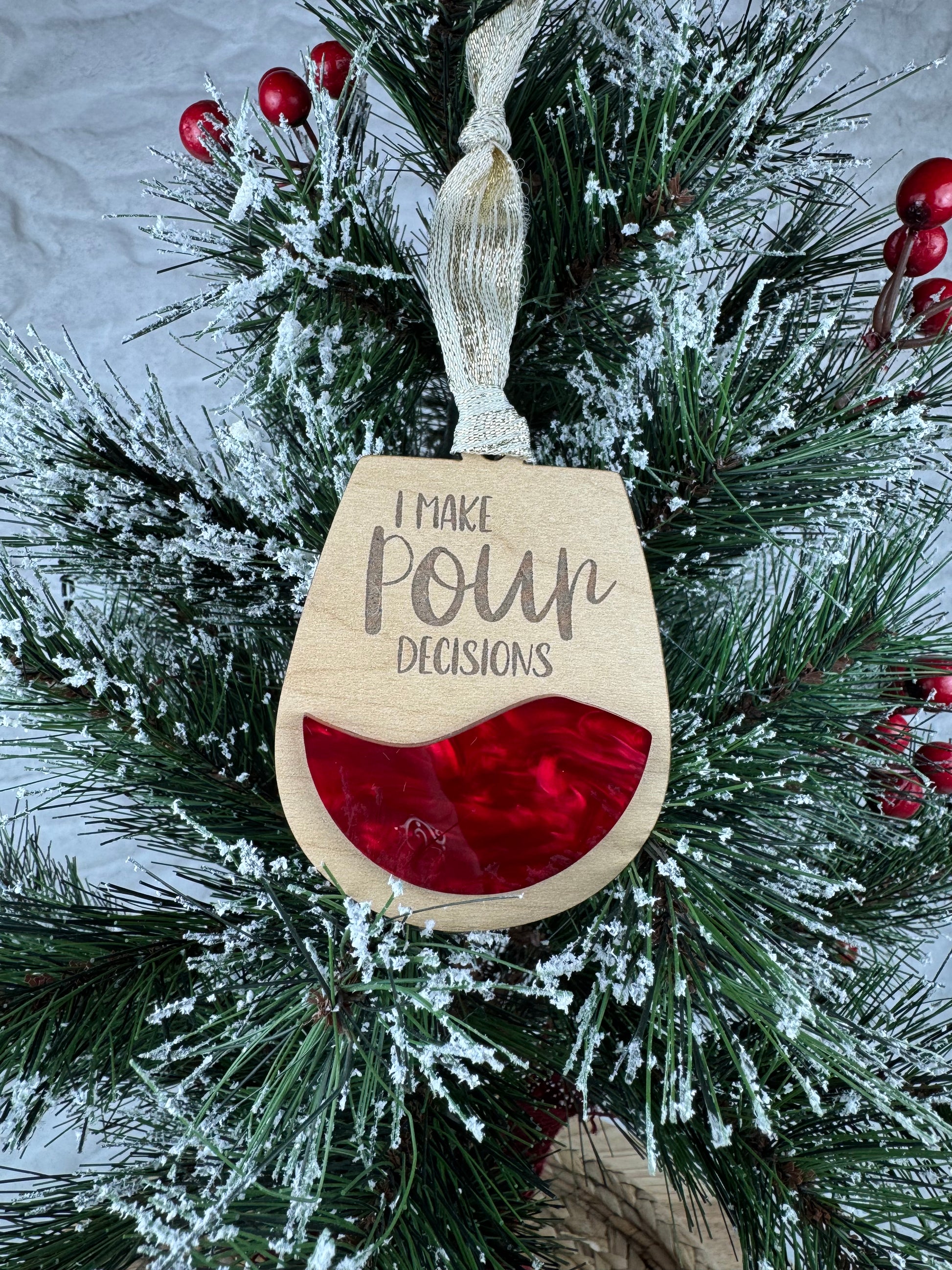 Ornament with 'I make pour decisions' on a tree