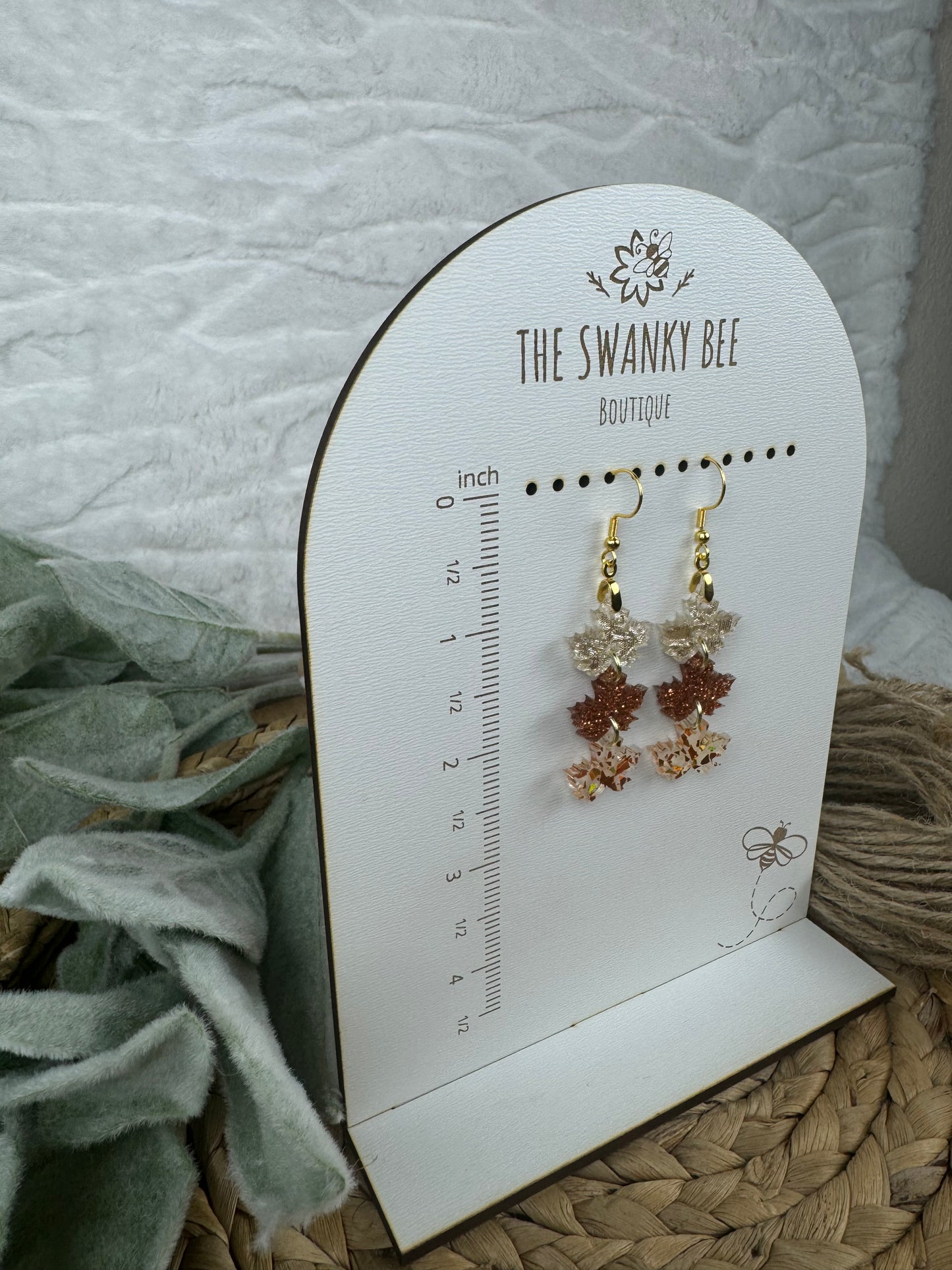 Leaf earrings on The Swanky Bee stand