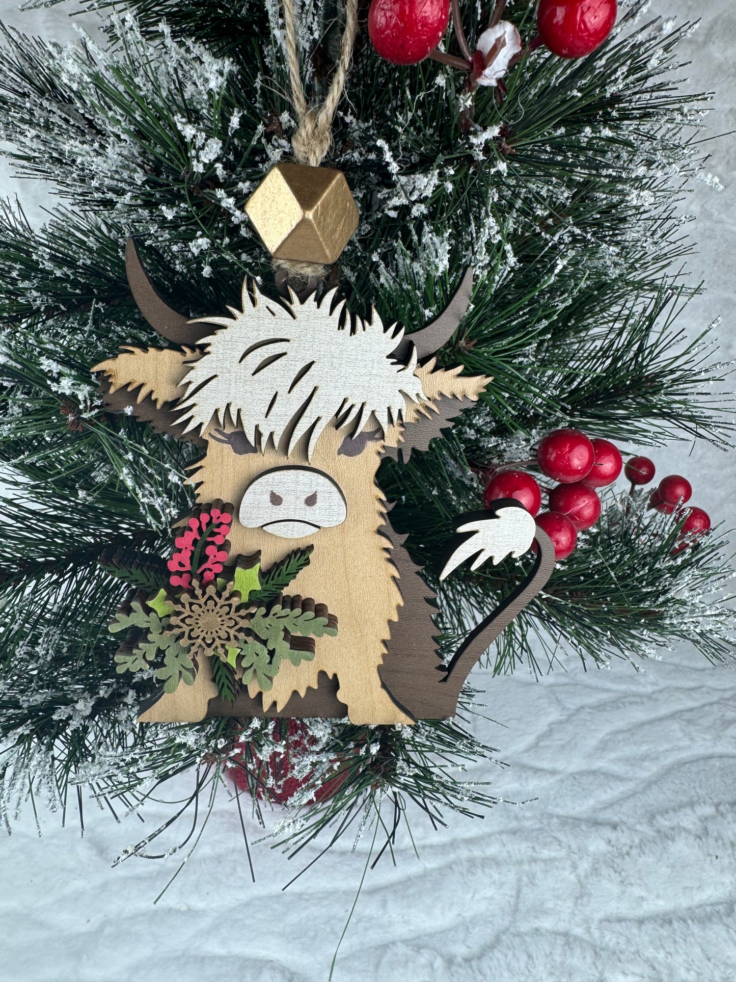 Festive Highland Cow ornament with red berries