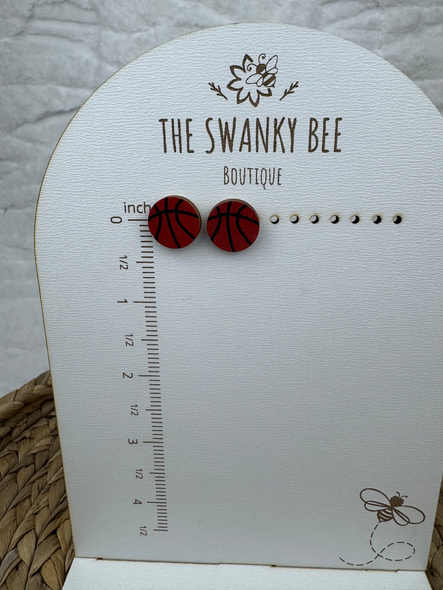 Basketball studs earrings on measurement card