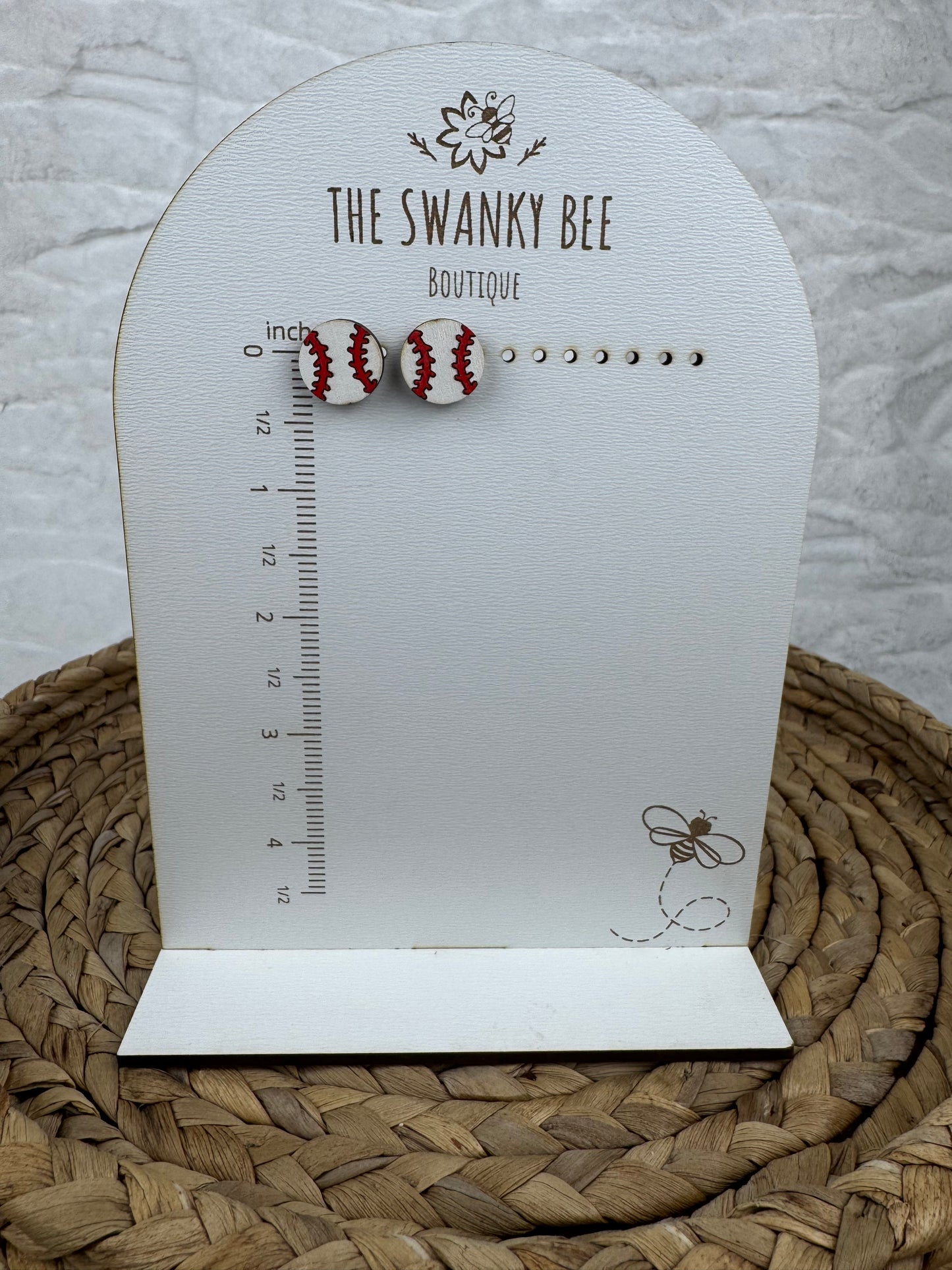 Baseball studs earrings on measurement card